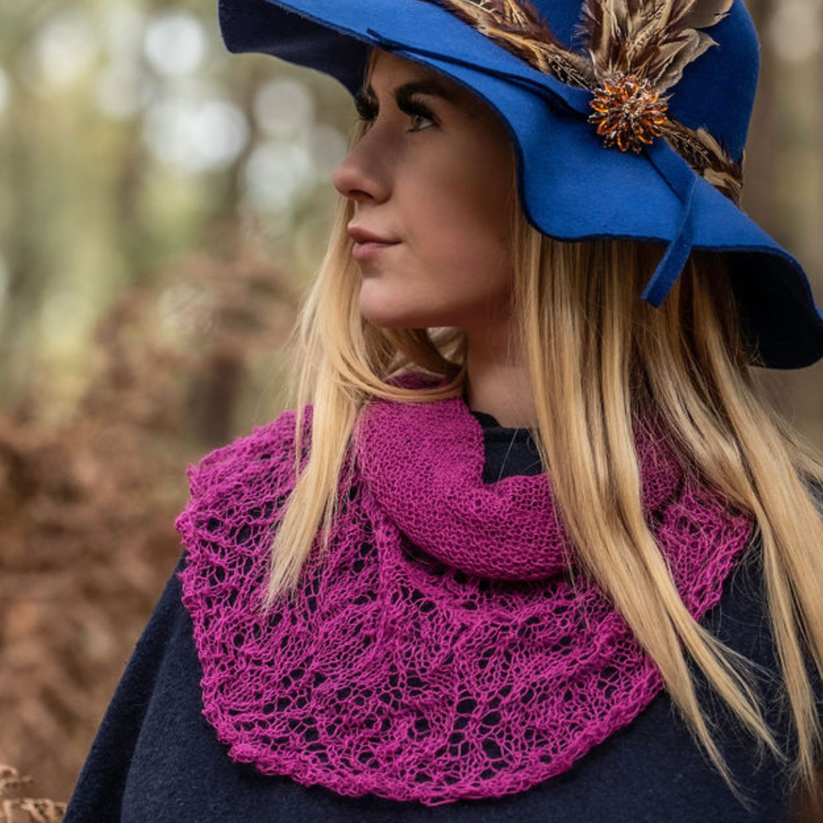 Feather brooch on side of blue hat