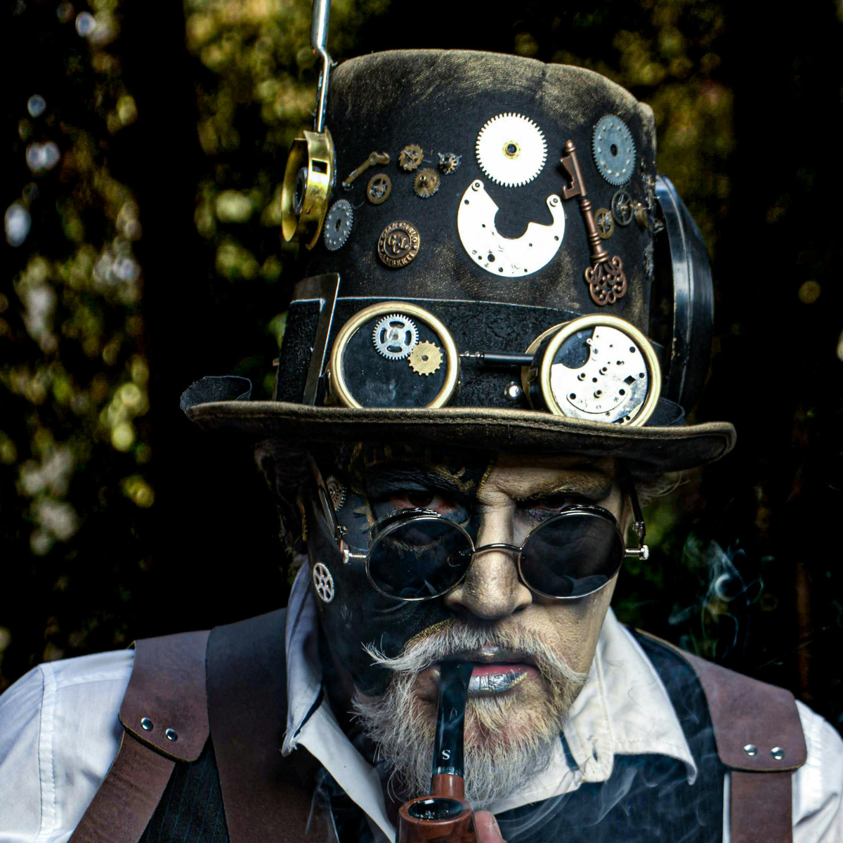 Gentleman Steampunker wearing a top hat covered in cogs and dials.