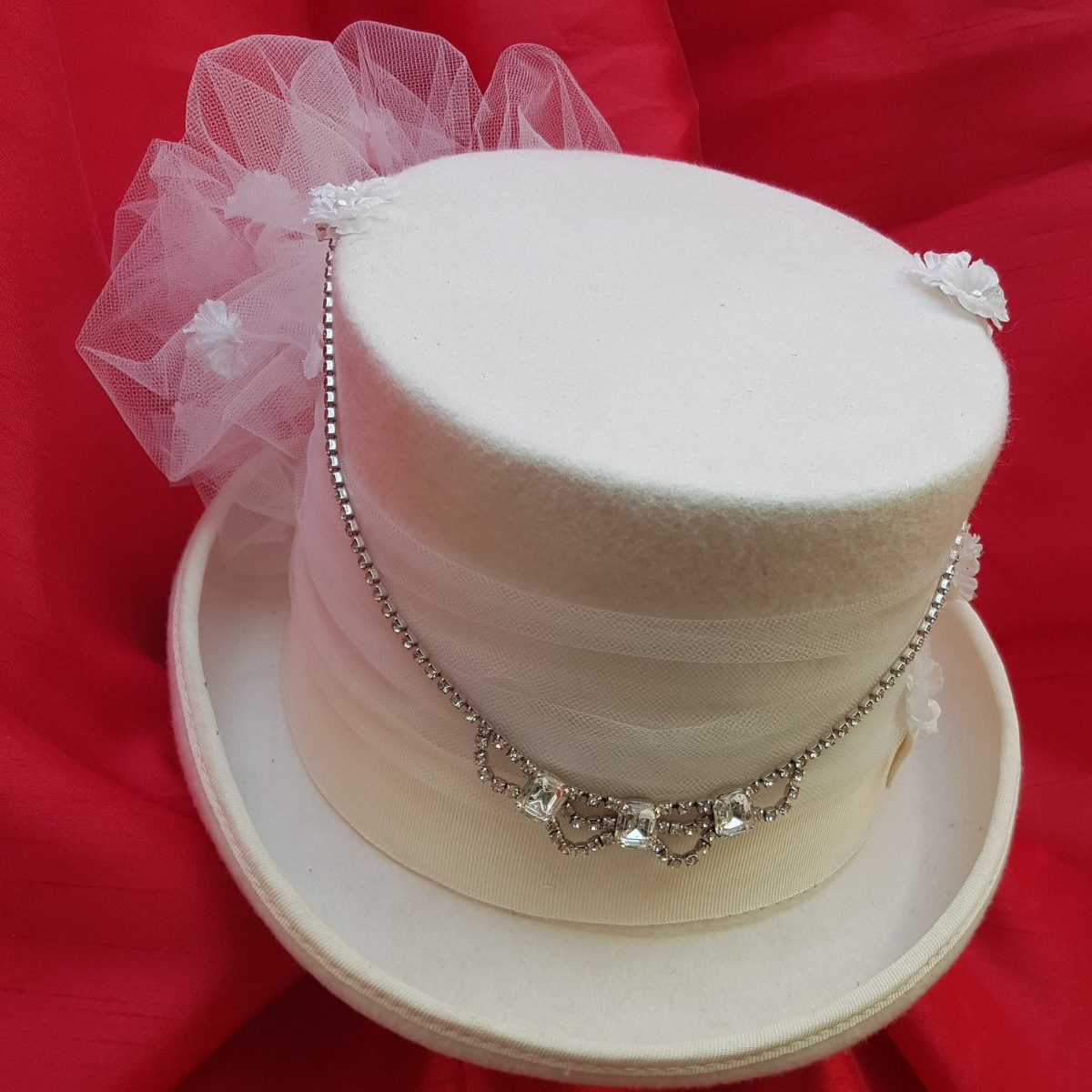 Ladies steampunk top hat in white with netting and embellishment