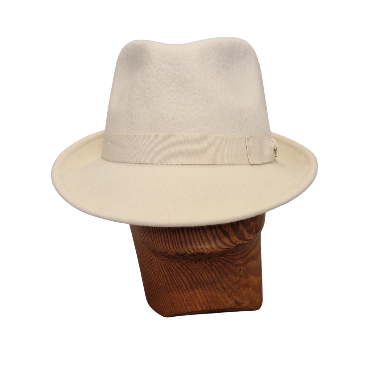 A cream felt trilby hat with a matching band and bow, displayed on a brown wooden mannequin head against a white background.  Front