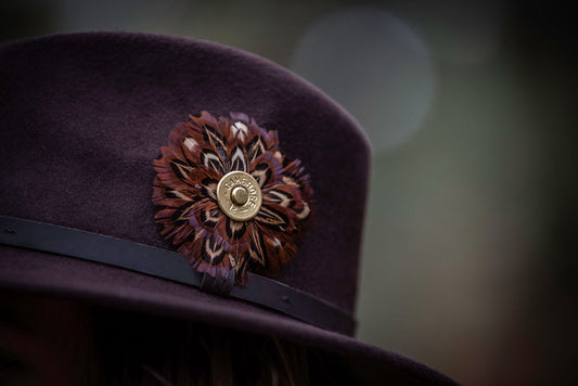 Beautiful Circular Feather Brooch with Cartridge Decoration